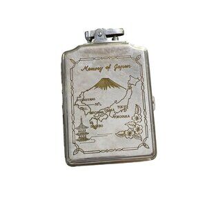 A VINTAGE OMEGA CIGARETTE CASE AND LIGHTER COMBO. MEMORY OF JAPAN ON THE FRONT.